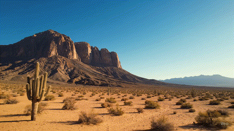 A simple AI video of a mountain in the desert, framed in a standard, uninteresting shot.